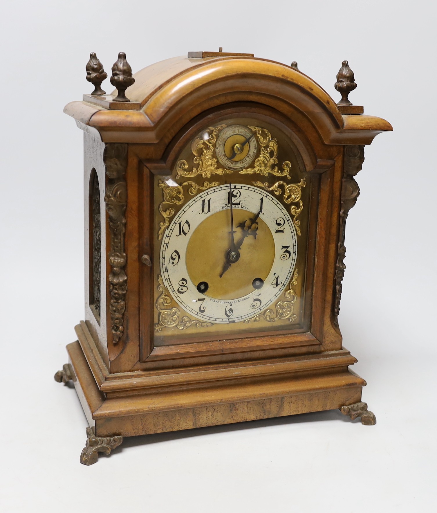A walnut ting tang mantel clock, 34cms high